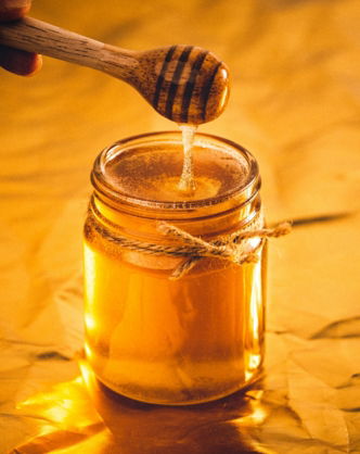 clear glass jar with brown liquid